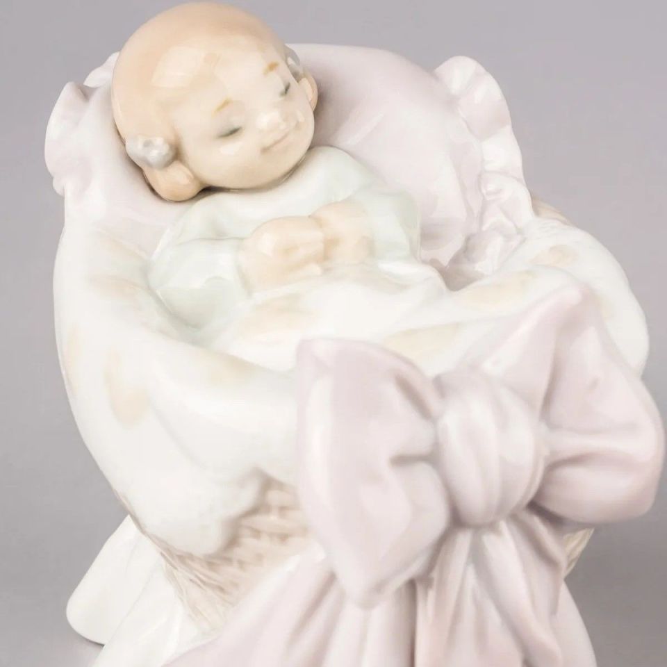 A NEW TREASURE GIRL FIGURINE