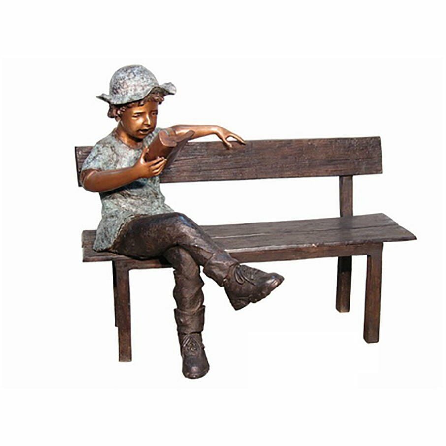 CHILD SITTING ON A BENCH