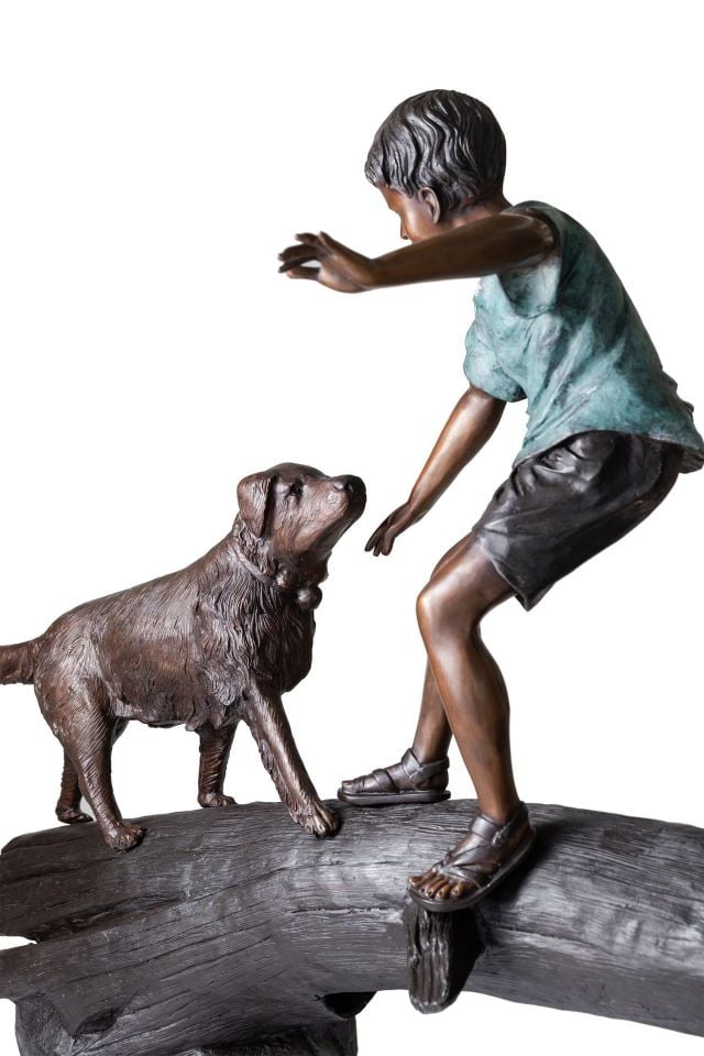 CHILDREN PLAYING ON A TREE STUMP
