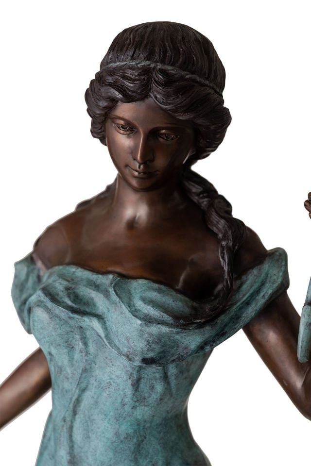 WOMAN HOLDING FLOWER FOUNTAIN