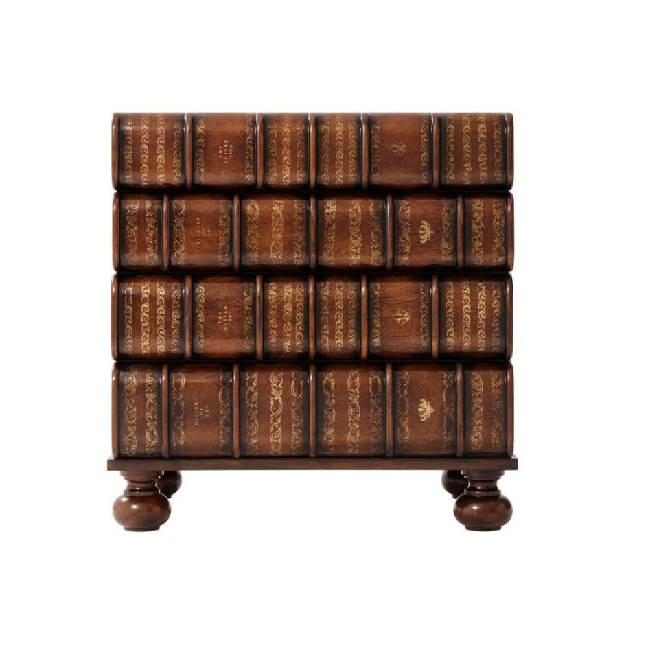 A HAND CARVED AND GILT FAUX BOOK CHEST